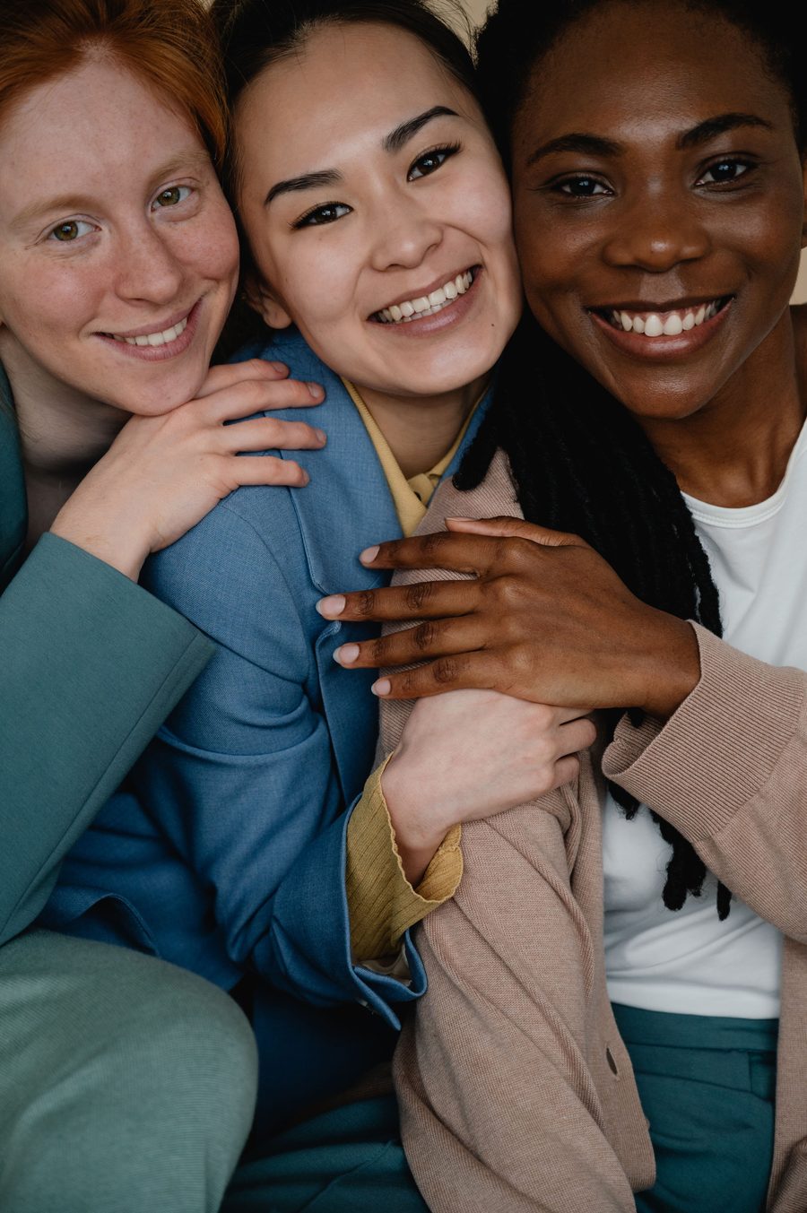 Three women smiling together