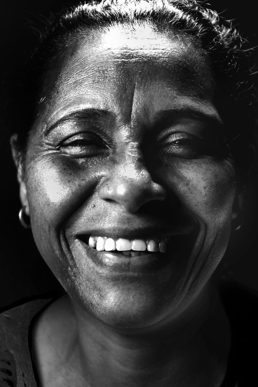 A woman smiling warmly
