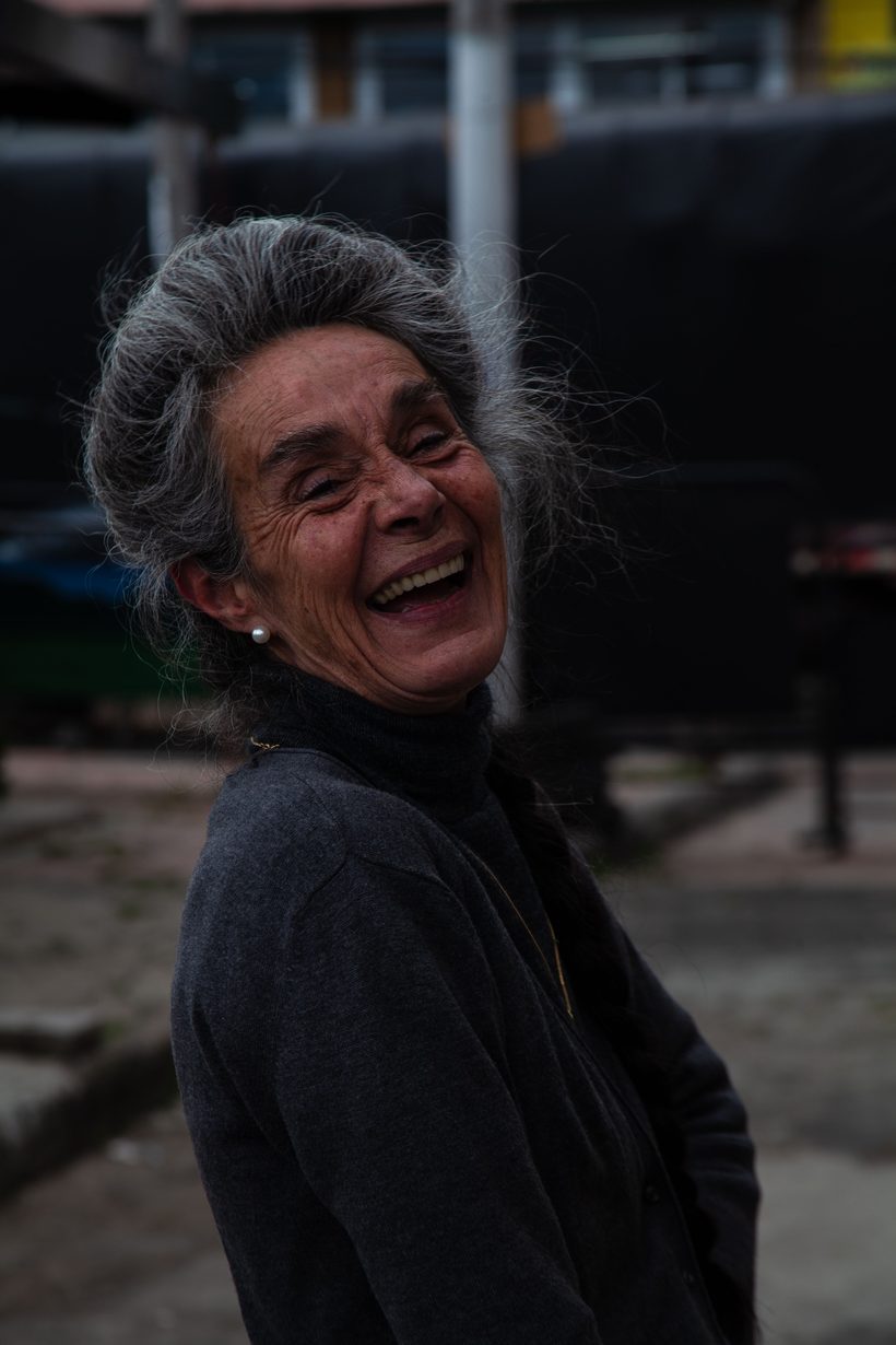 An older woman laughing